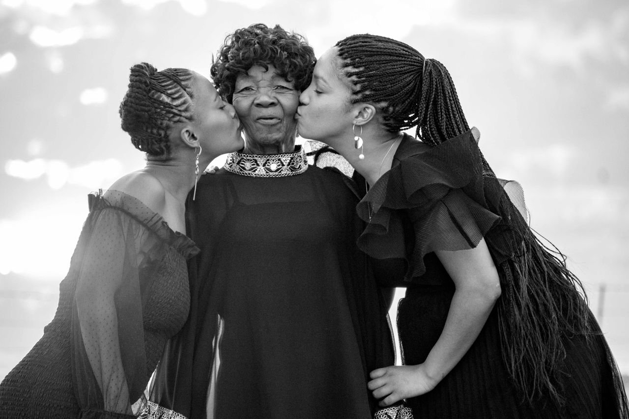A joyful family moment captured in black and white, showcasing love and togetherness.